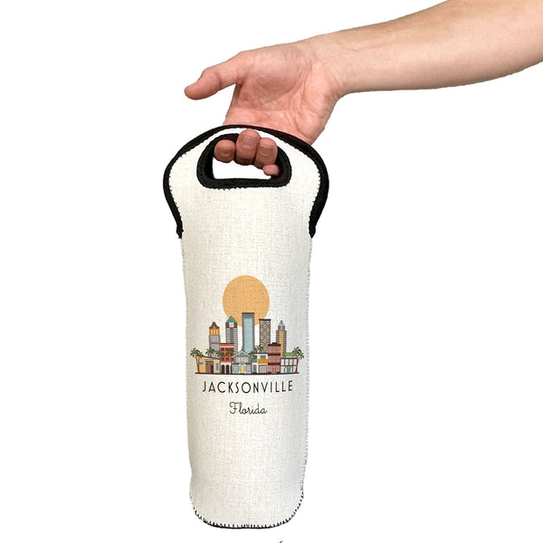 Hand holding a white wine bottle holder with Jacksonville, Florida design on a white background
