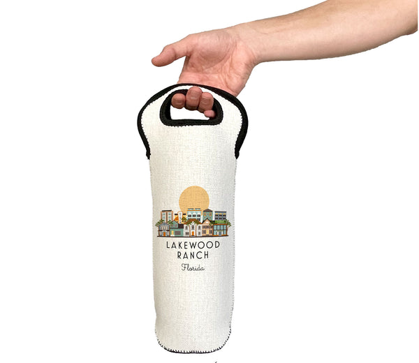 Hand holding a white wine bottle bag with 'Lakewood Ranch, Florida' text and graphic on a white background