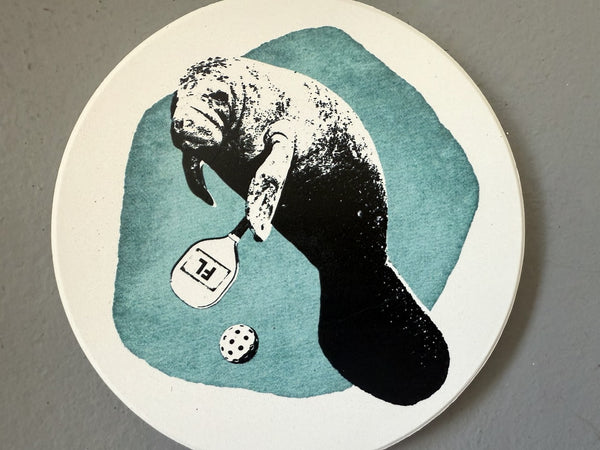 Manatee Playing Pickleball Absorbent Flat Ceramic Coaster with Cork Backing