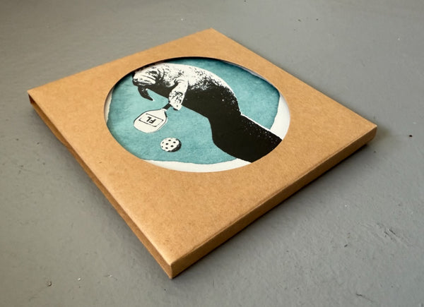 Manatee Playing Pickleball Absorbent Flat Ceramic Coaster with Cork Backing