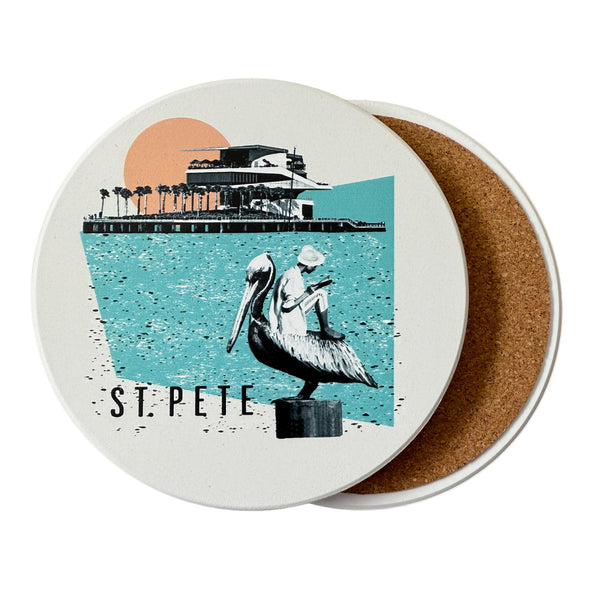 Coaster with a design of two people and a pelican, labeled 'St. Pete', on a white background.