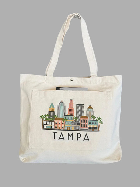 Tote bag with a cityscape design and 'Tampa' text on a dark background