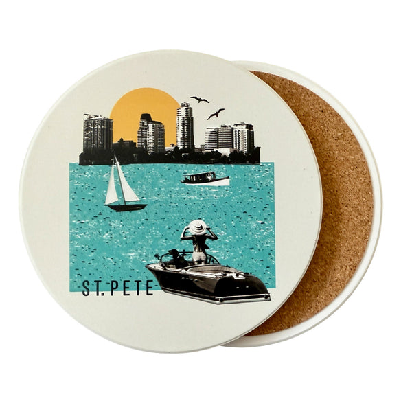 Coaster with a design of a city skyline, sailboat, and person on a boat with 'St. Pete' text.