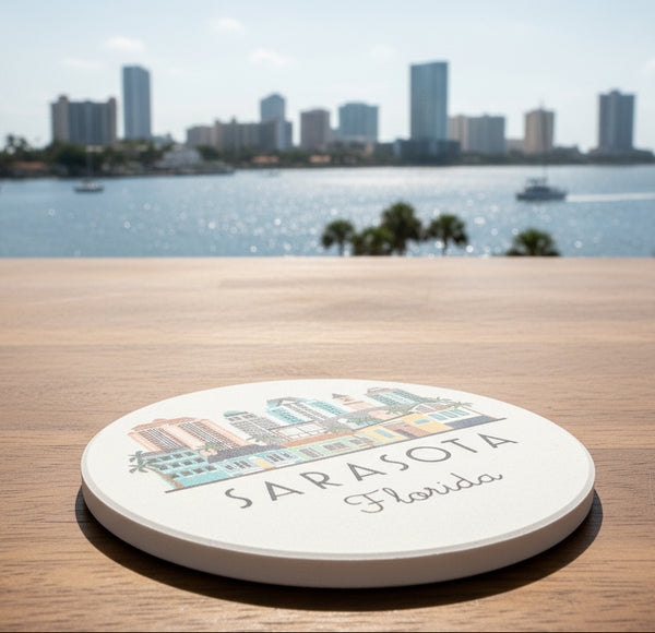 Round coaster with Sarasota, Florida illustration on a gray surface