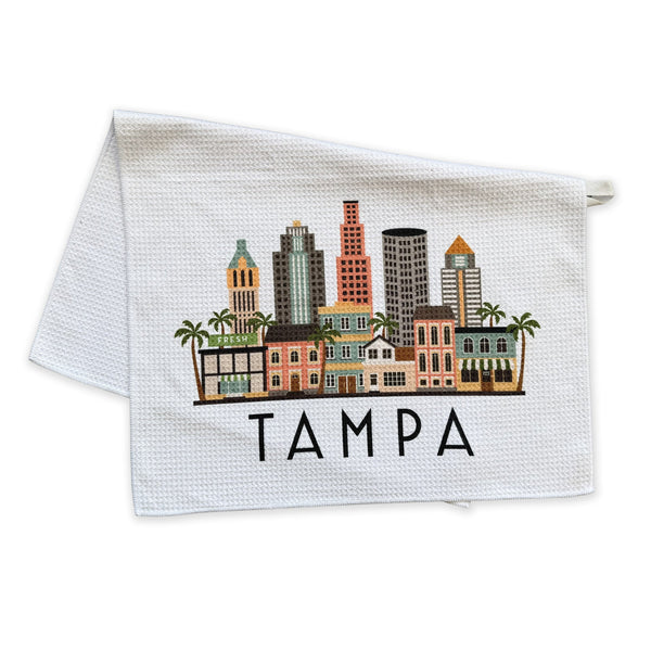 Towel with a graphic of Tampa's skyline and the word 'Tampa' on a white background