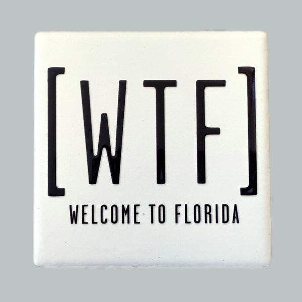 Sign with 'WTF' and 'Welcome to Florida' text on a gray background