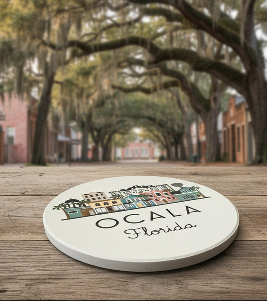 Round coaster with Ocala, Florida design on a gray surface